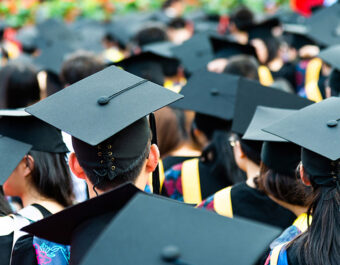 Black Grad caps stock photo.600px